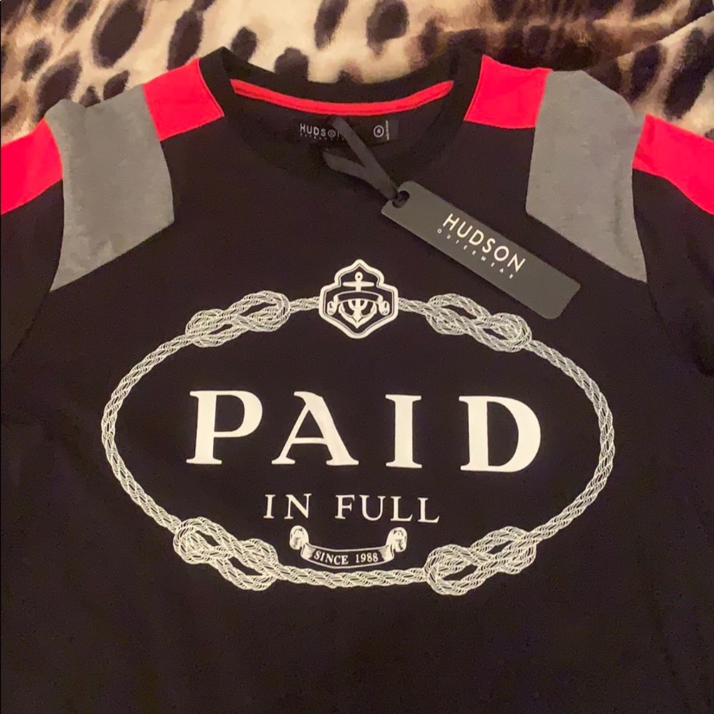 Medium black, red and very Hudson shirt says paid